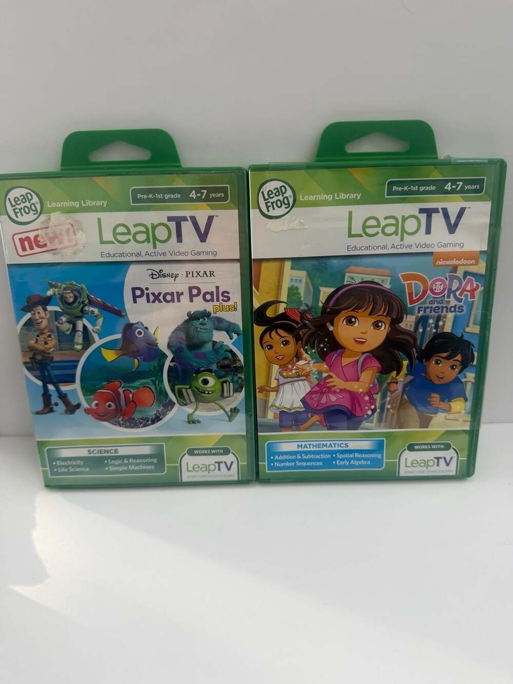 LeapFrog LeapTV Learning Video Games Lot: Pixar Pals Plus! and Dora and Friends